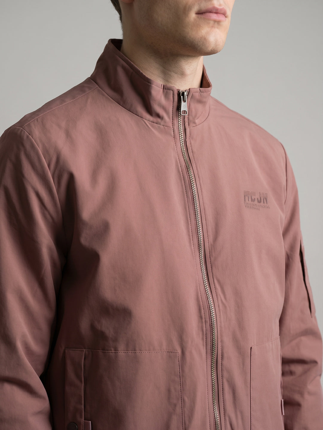 Men Peach Solid Stand Collar Full Sleeve Bomber Jacket