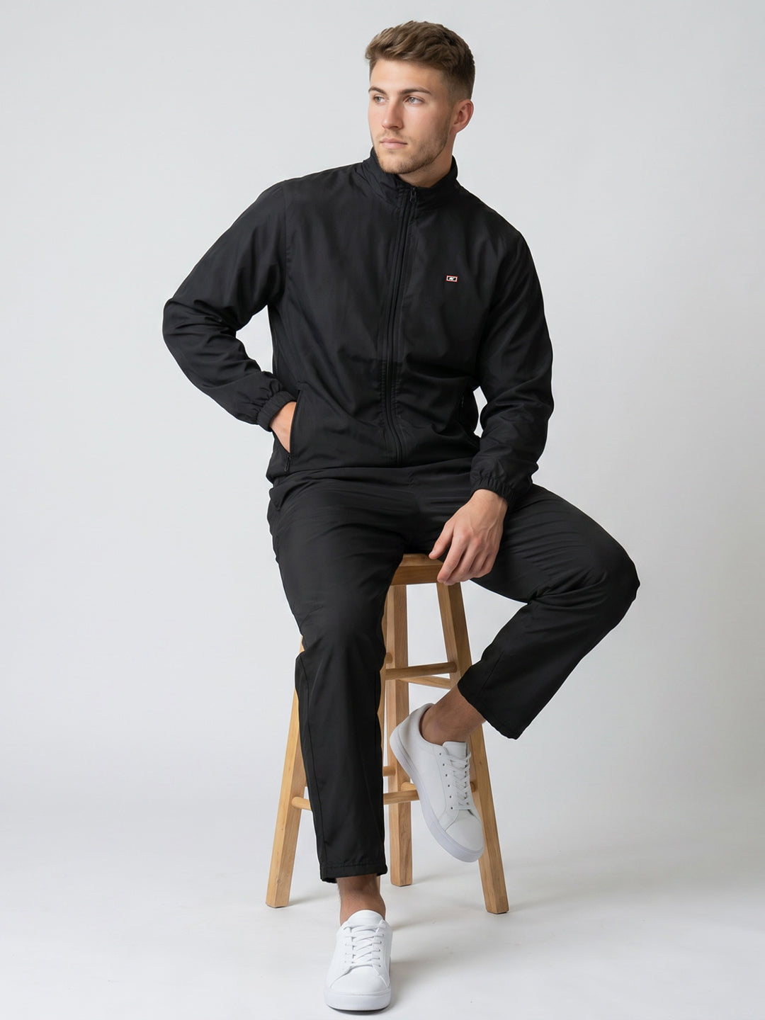 Men Black Solid Stand Collar Full Sleeve Tracksuit