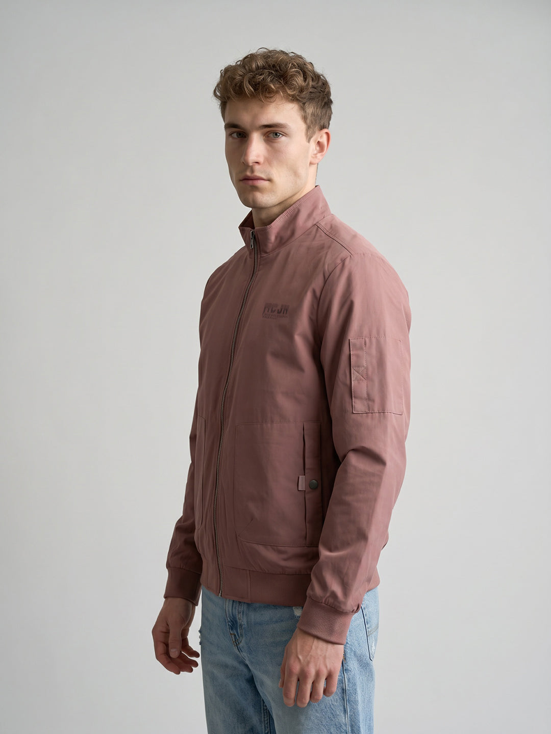 Men Peach Solid Stand Collar Full Sleeve Bomber Jacket