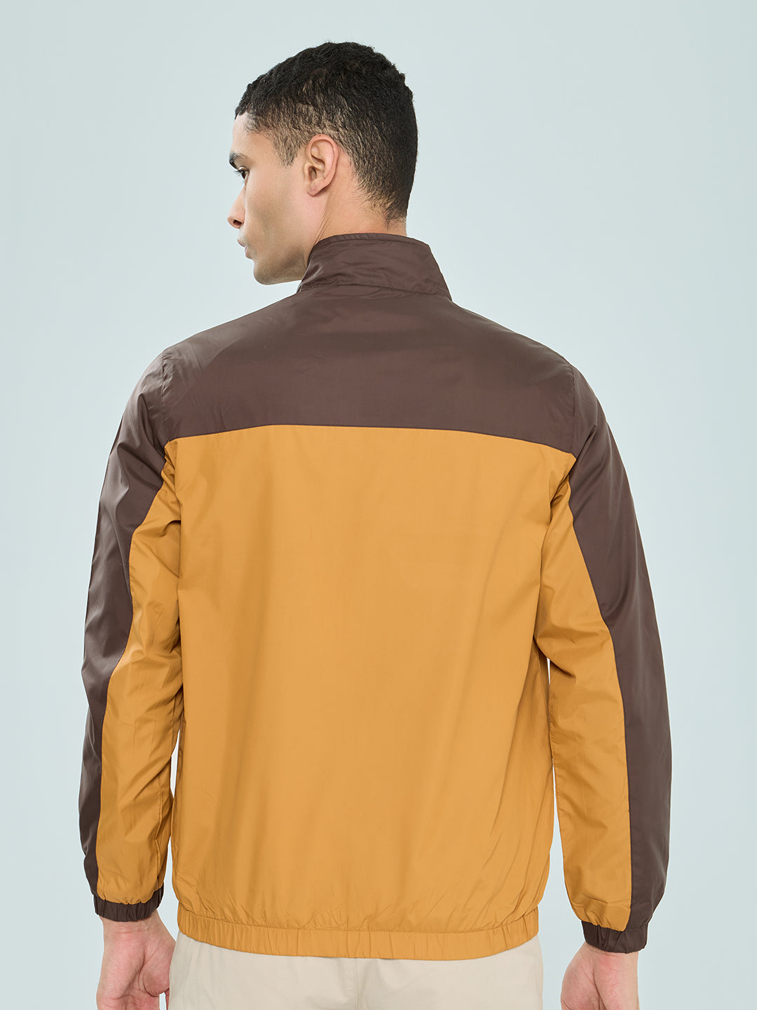 Men Mustard Self Design Mandarin Collar Full Sleeve Windcheater